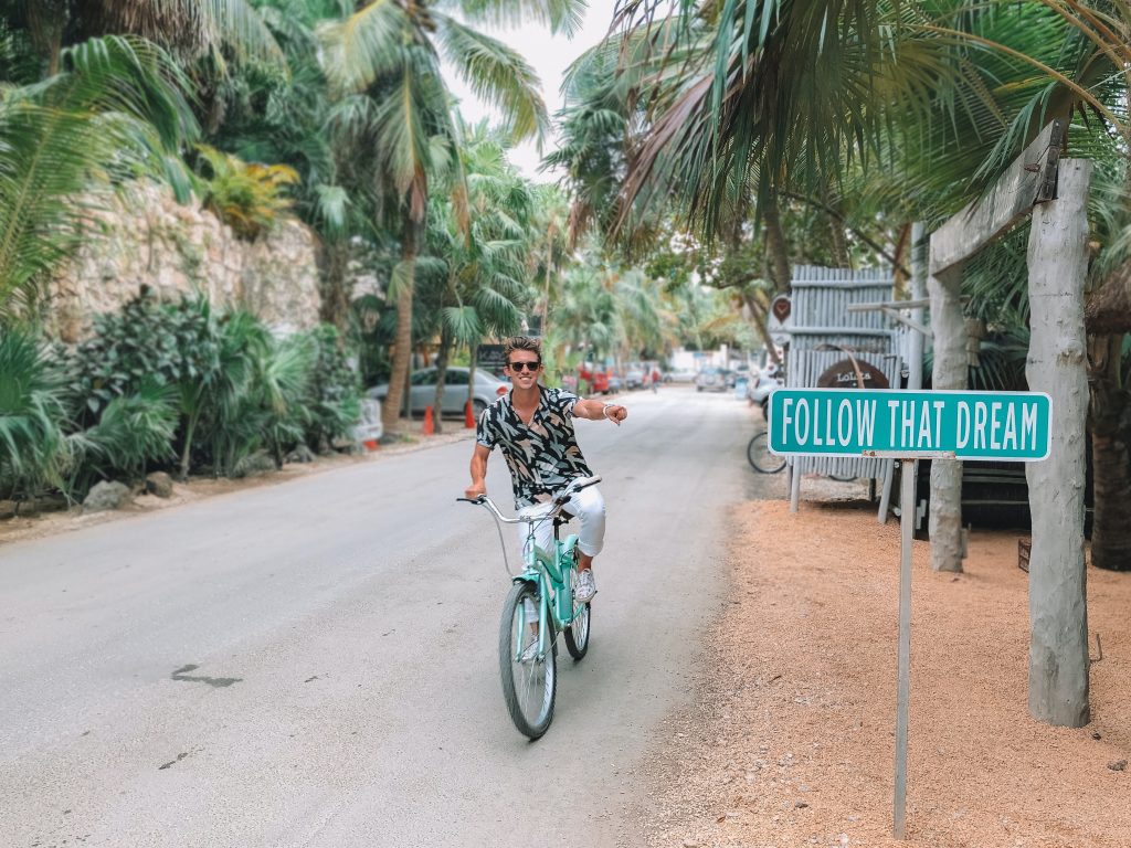 Tulum Riviera Maya Follow That Dream Guy Riding a Bike